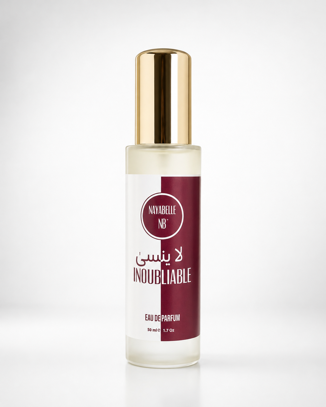 Inoubliable Nayabelle — eau de parfum unisexe boisée ambrée 50 ml, flacon doré sur fond neutre